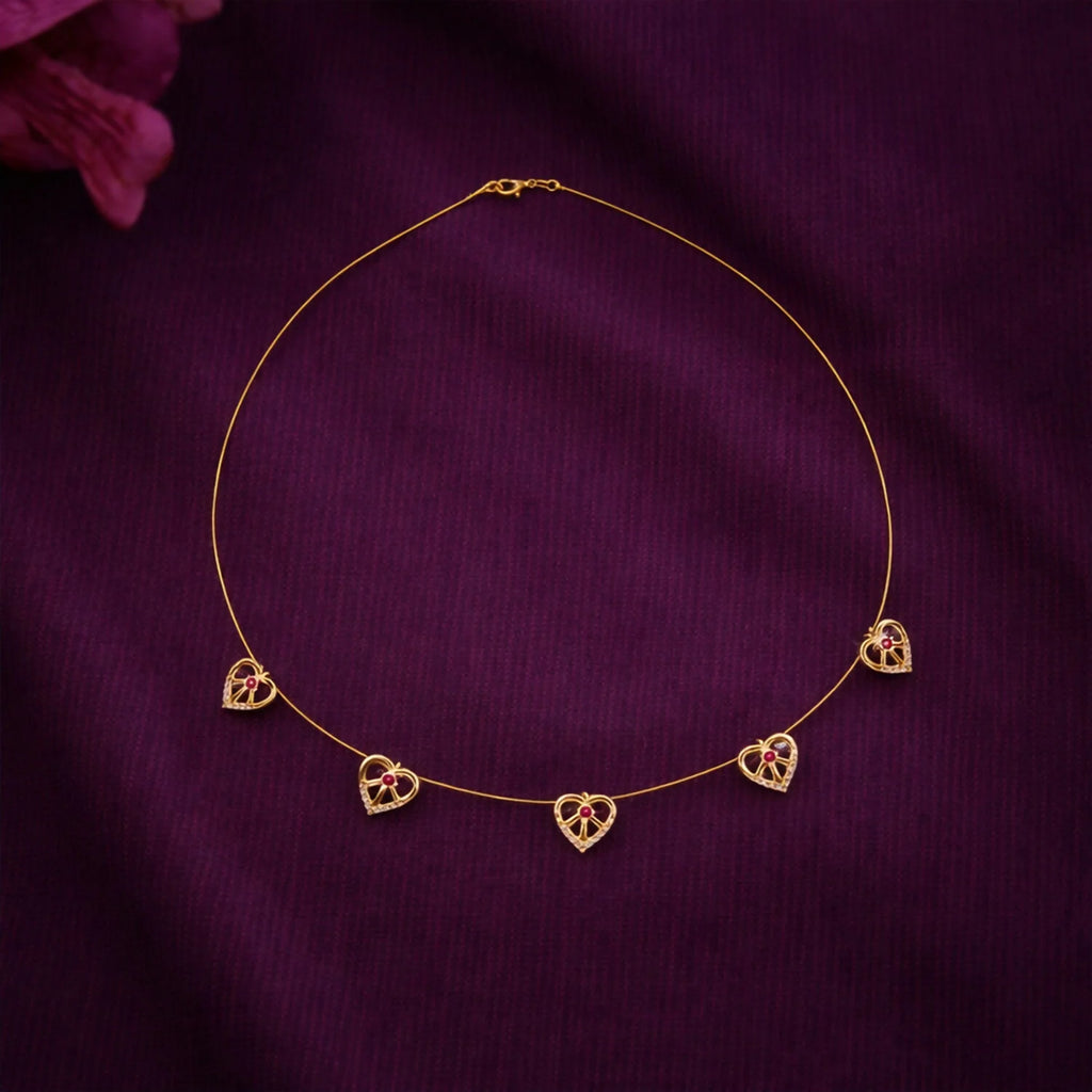 Elegant Gold-Tone Multi-Heart Charm Necklace with Red Crystals
