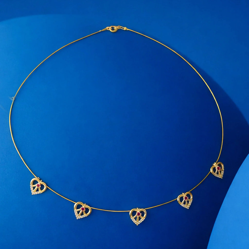 Elegant Gold-Tone Multi-Heart Charm Necklace with Red Crystals